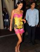 Kendall Jenner slips into a Versace dress for dinner with friends during NYFW