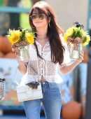 Sarah Hyland Carries a Bouquet of Halloween Sunflowers in Los Angeles