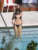 Kaia Gerber in Black Bikini at a Pool in Miami