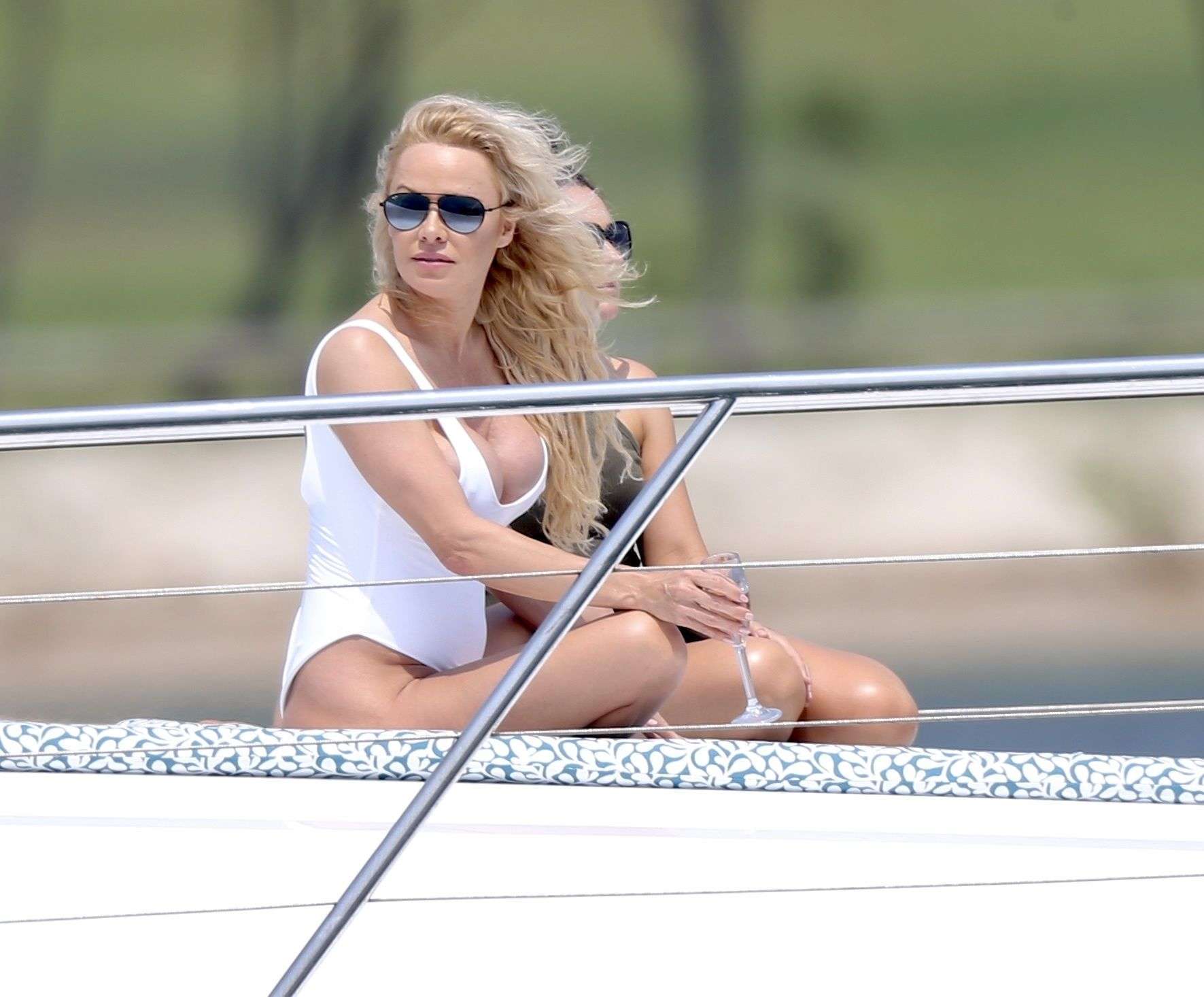 Pamela Anderson in White Swimsuit for a Photoshoot on the Gold Coast
