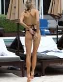 Charlotte Mckinney in Black Bikini Soaks up some Sun in Miami