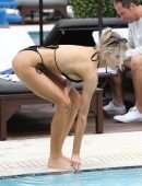 Charlotte Mckinney in Black Bikini Soaks up some Sun in Miami
