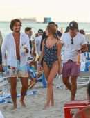 Kimberley Garner Booty in a Blue Floral One-piece on the Beach in Miami