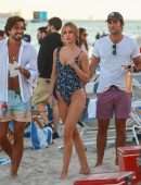 Kimberley Garner Booty in a Blue Floral One-piece on the Beach in Miami