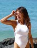 Lizzie Cundy in White Swimsuit on the Beach in Barbados