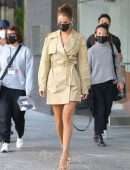 Bella Hadid Cleavage while wearing a Michael Kors Trench Coat Dress in New York