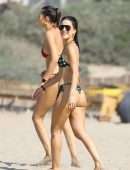 Camila Coelho Booty in a Black and Green Bikini at the Beach