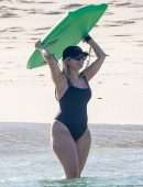 Bebe Rexha Booty in a Black Swimsuit on a Beach Surfing in Cabo San Lucas