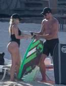 Bebe Rexha Booty in a Black Swimsuit on a Beach Surfing in Cabo San Lucas