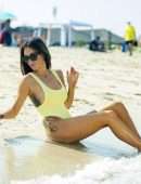 Laura Anderson in a Yellow Swimsuit Enjoys a Day at the Beach in Dubai