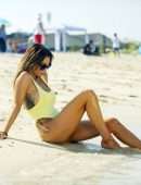 Laura Anderson in a Yellow Swimsuit Enjoys a Day at the Beach in Dubai