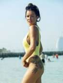 Laura Anderson in a Yellow Swimsuit Enjoys a Day at the Beach in Dubai