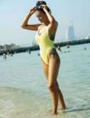 Laura Anderson in a Yellow Swimsuit Enjoys a Day at the Beach in Dubai