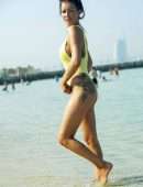 Laura Anderson in a Yellow Swimsuit Enjoys a Day at the Beach in Dubai