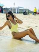Laura Anderson in a Yellow Swimsuit Enjoys a Day at the Beach in Dubai
