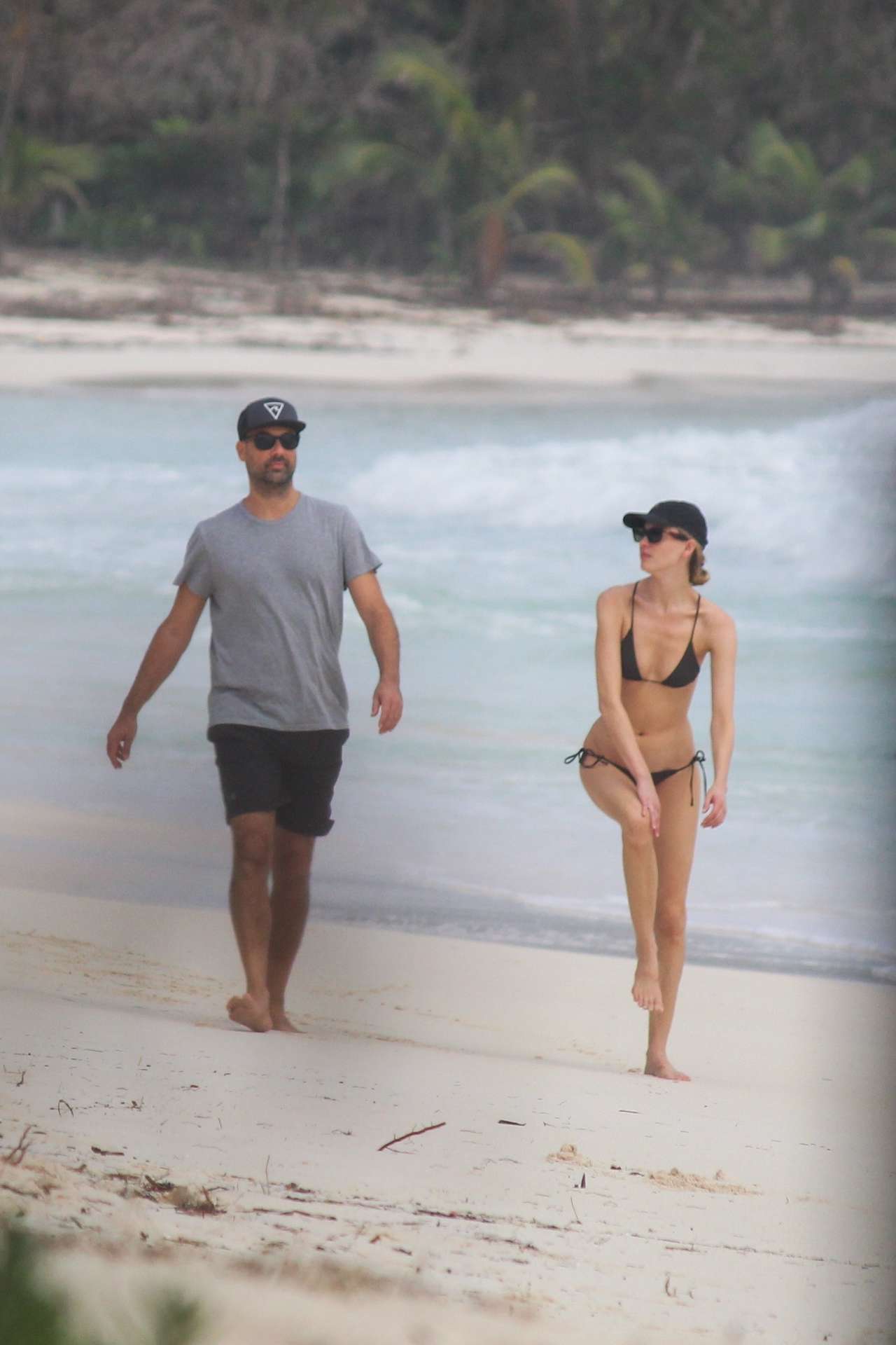 Martha Hunt in Bikini, Walking on the Beach with her Fiancé in Tulum, Mexico
