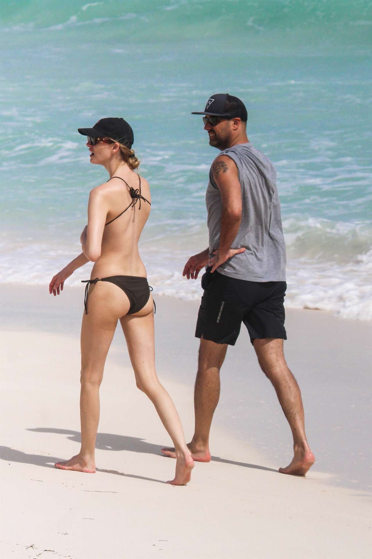 Martha Hunt in Bikini, Walking on the Beach with her Fiancé in Tulum, Mexico