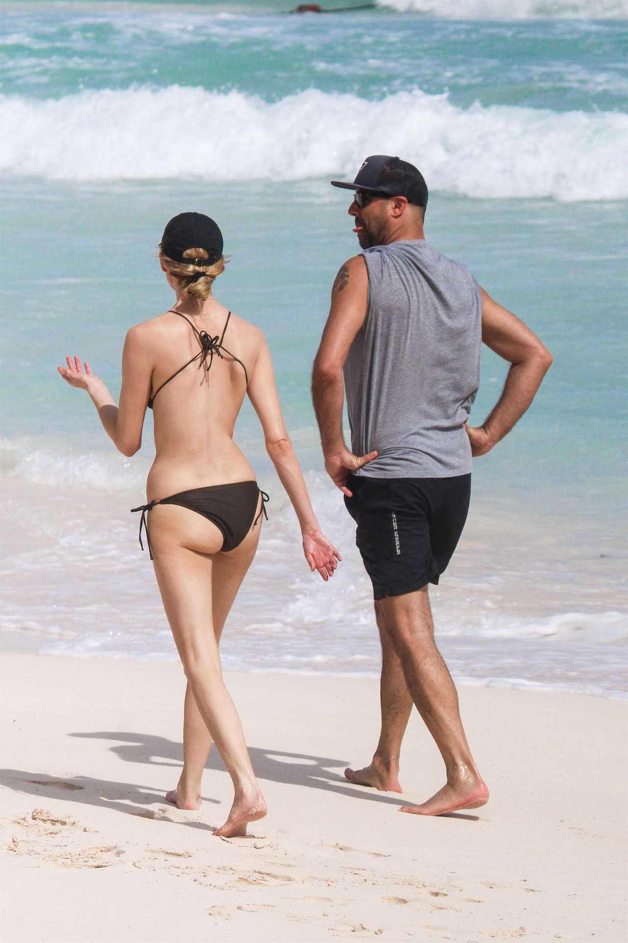 Martha Hunt in Bikini, Walking on the Beach with her Fiancé in Tulum, Mexico