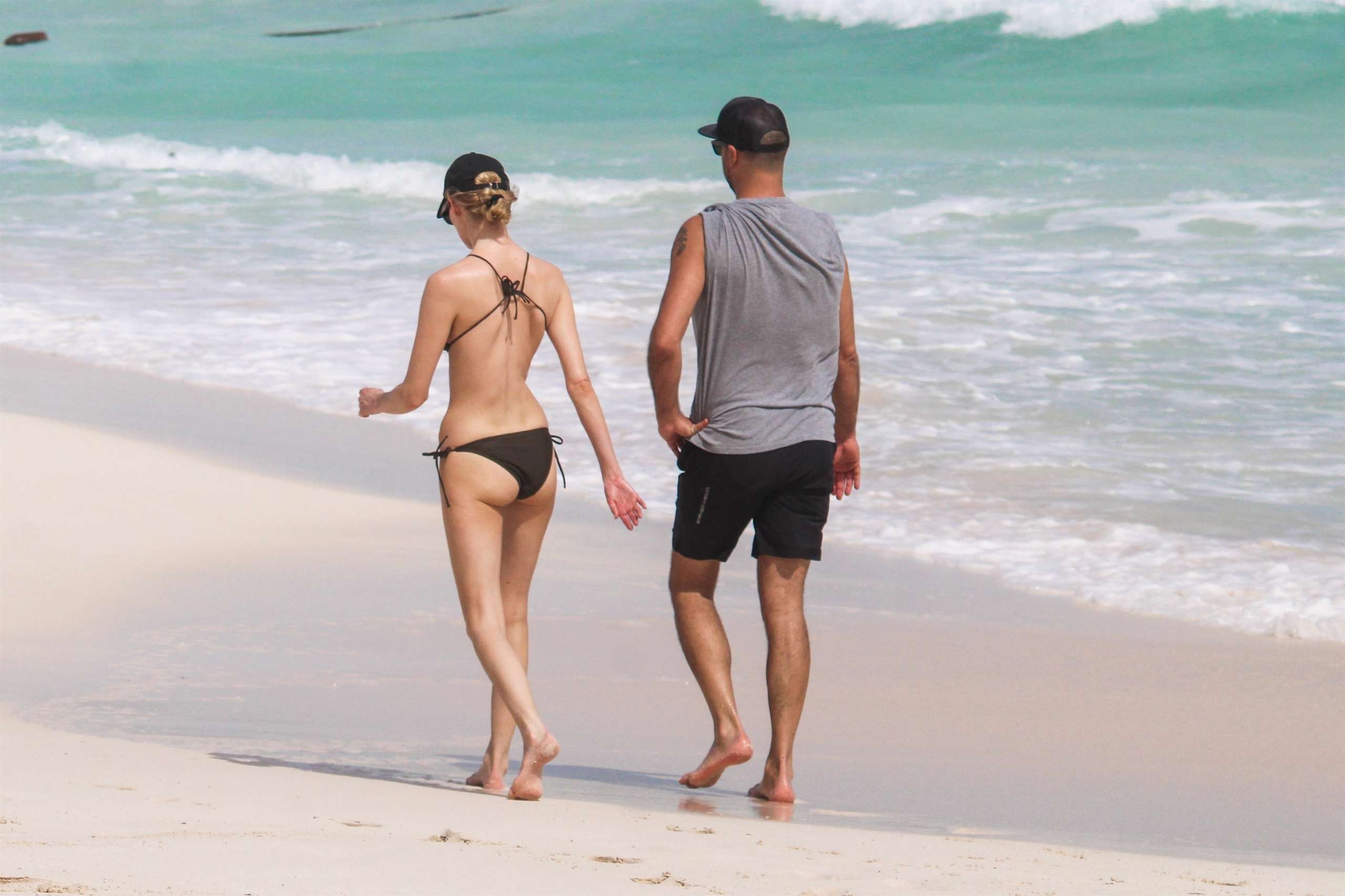 Martha Hunt in Bikini, Walking on the Beach with her Fiancé in Tulum, Mexico