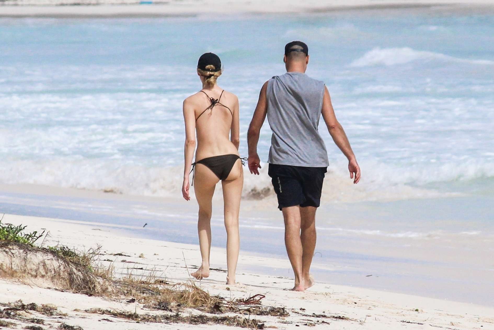 Martha Hunt in Bikini, Walking on the Beach with her Fiancé in Tulum, Mexico
