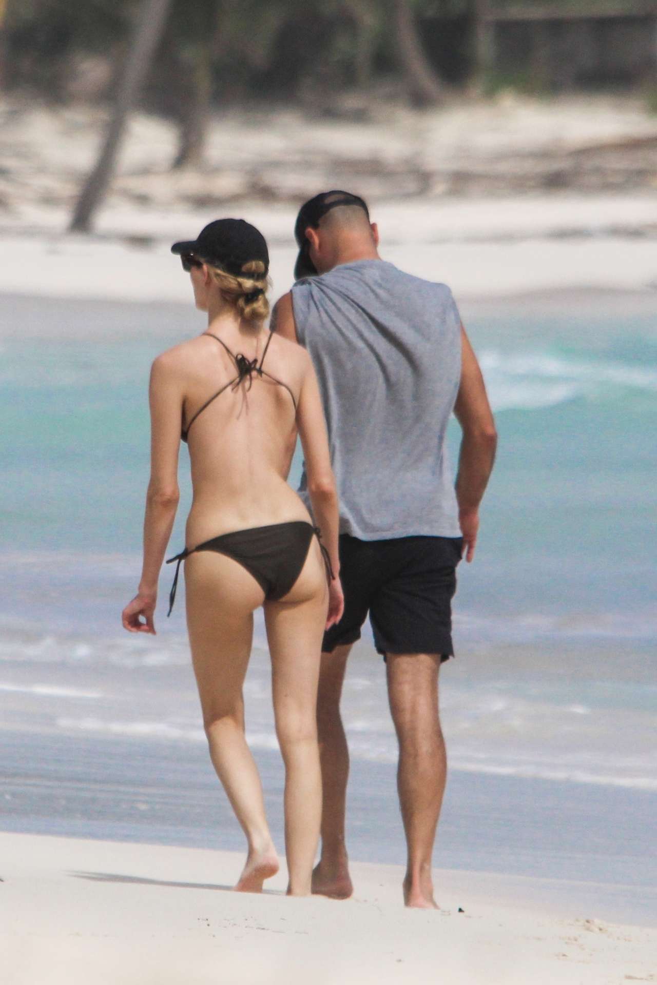 Martha Hunt in Bikini, Walking on the Beach with her Fiancé in Tulum, Mexico