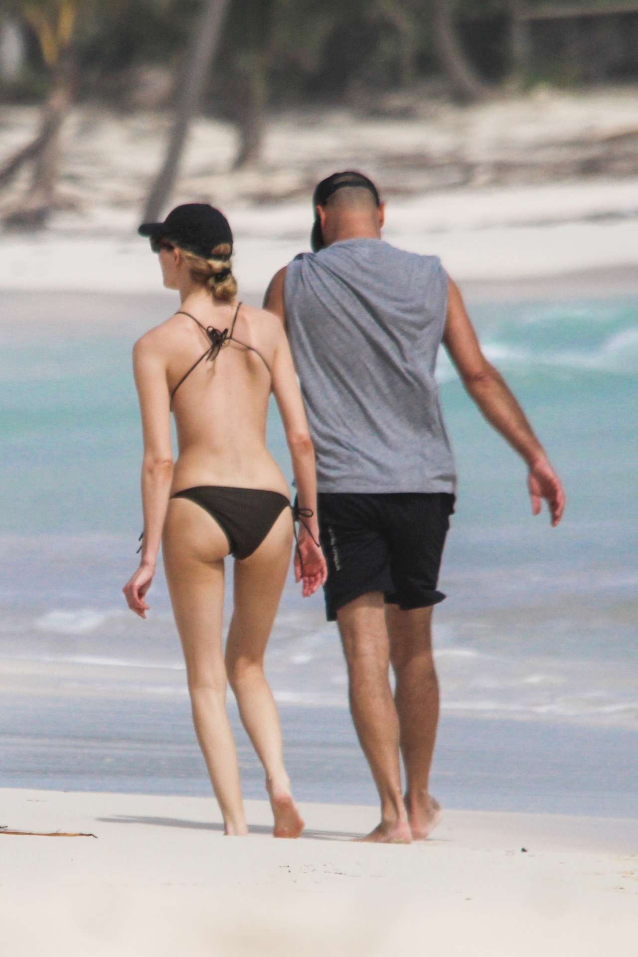 Martha Hunt in Bikini, Walking on the Beach with her Fiancé in Tulum, Mexico
