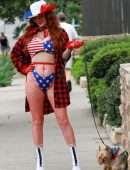 Phoebe Price Booty, with her Dog and Posing in a Patriotic Outfit
