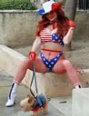 Phoebe Price Booty, with her Dog and Posing in a Patriotic Outfit