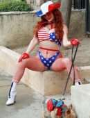 Phoebe Price Booty, with her Dog and Posing in a Patriotic Outfit