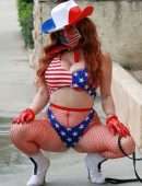 Phoebe Price Booty, with her Dog and Posing in a Patriotic Outfit