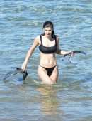 Alexandra Daddario Pokies in a Black Bikini on the Beach in Maui