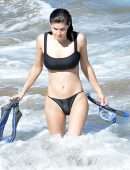 Alexandra Daddario Pokies in a Black Bikini on the Beach in Maui