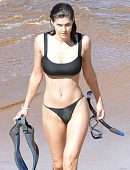 Alexandra Daddario Pokies in a Black Bikini on the Beach in Maui