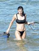 Alexandra Daddario Pokies in a Black Bikini on the Beach in Maui