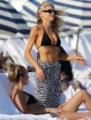 Charlotte McKinney in Black String Bikini as she Hits the Beach in Miami