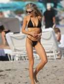 Charlotte McKinney in Black String Bikini as she Hits the Beach in Miami