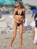 Charlotte McKinney in Black String Bikini as she Hits the Beach in Miami