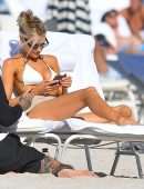 Charlotte McKinney Cleavage on the Beach in Miami