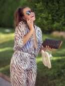 Chloe Goodman in a Zebra Print Jumpsuit out on Holiday in Dubai