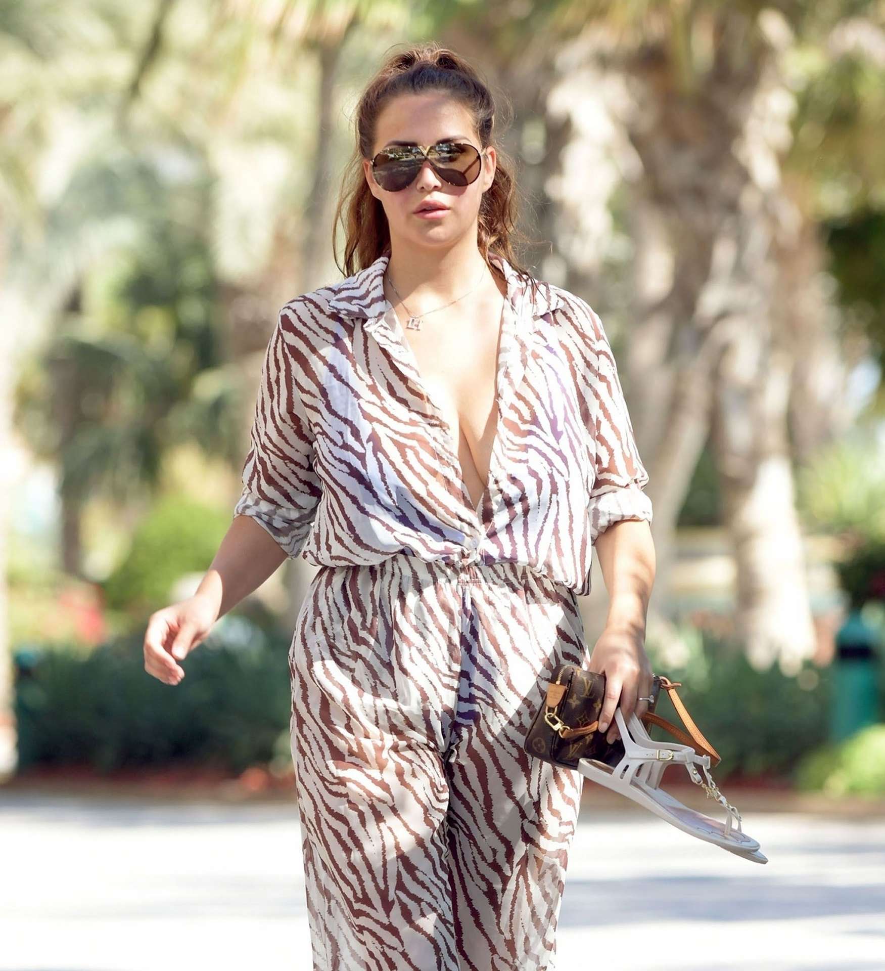 Chloe Goodman in a Zebra Print Jumpsuit out on Holiday in Dubai