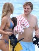 Kimberley Garner Cleavage in a Tiny Blue Bikini at the Beach in Barbados