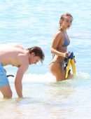 Kimberley Garner Cleavage in a Tiny Blue Bikini at the Beach in Barbados