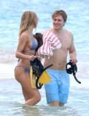 Kimberley Garner Cleavage in a Tiny Blue Bikini at the Beach in Barbados