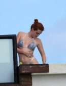 Bella Thorne Cleavage and Booty in a Tiny Thong Bikini in Tulum