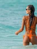 Izabel Goulart Booty in Orange Bikini on the Beach in St. Barts