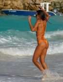 Izabel Goulart Booty in Orange Bikini on the Beach in St. Barts