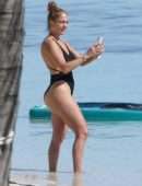 Jennifer Lopez Booty in a Black Swimsuit on the Beach in Turks and Caicos