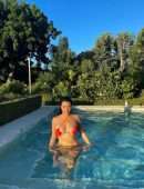 Kourtney Kardashian in a Red Bikini at a Pool