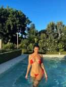 Kourtney Kardashian in a Red Bikini at a Pool