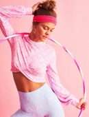 Nina Agdal Booty in Loveshack Fancy x Beach Riot Activewear Collection
